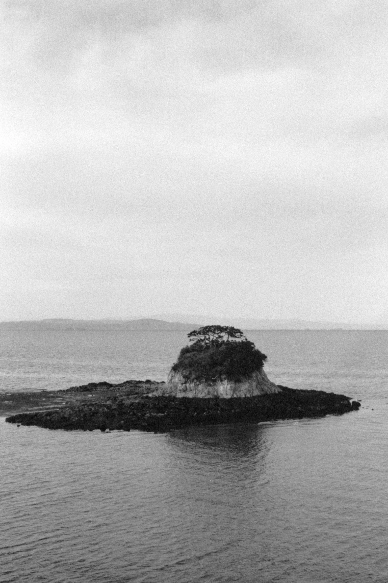 an island sits in the middle of water