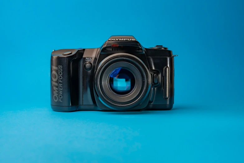 a camera sitting on top of a blue surface