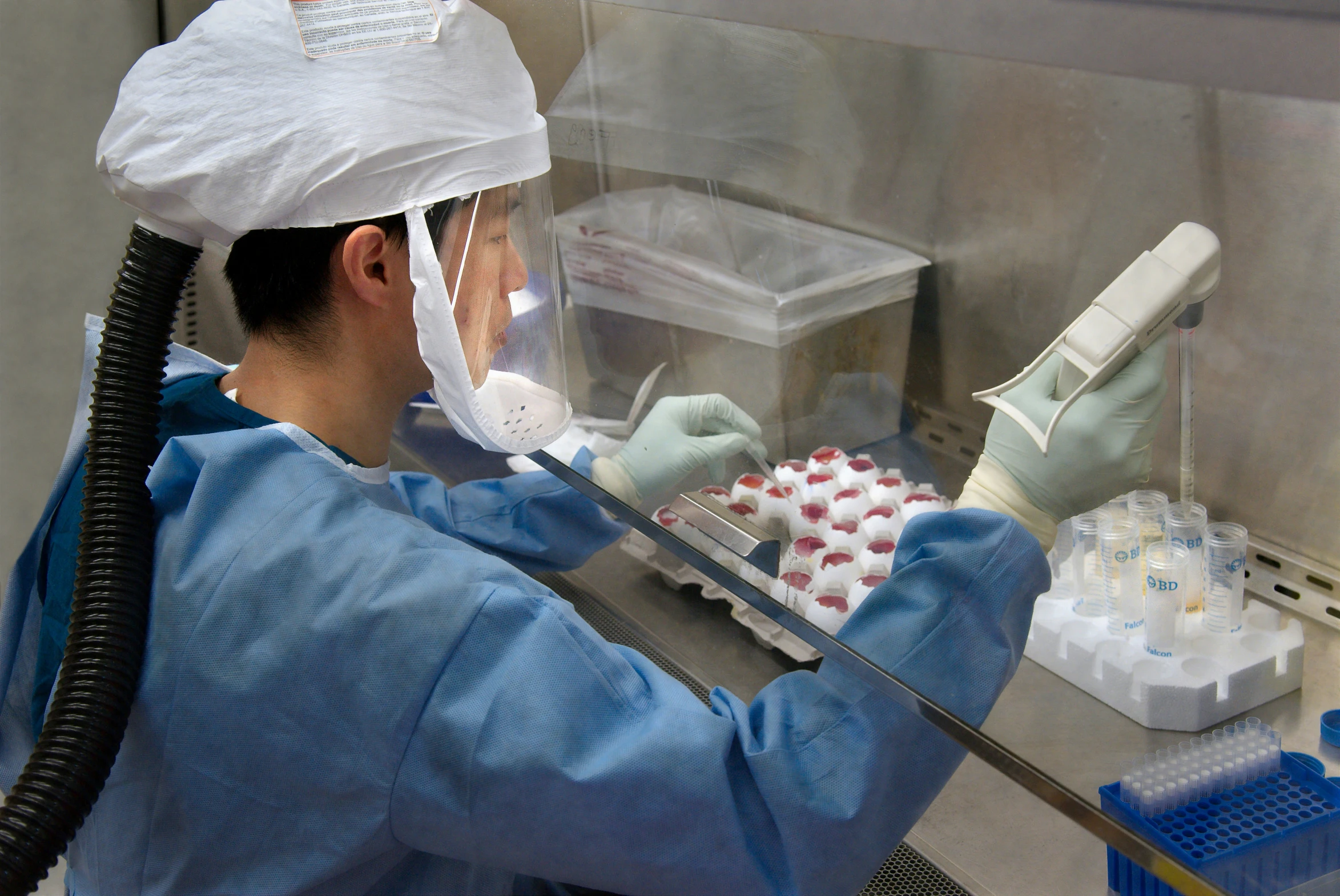 a man working with dental floss in a laboratory