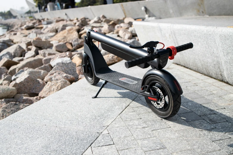 an electric scooter is parked on the side of a wall