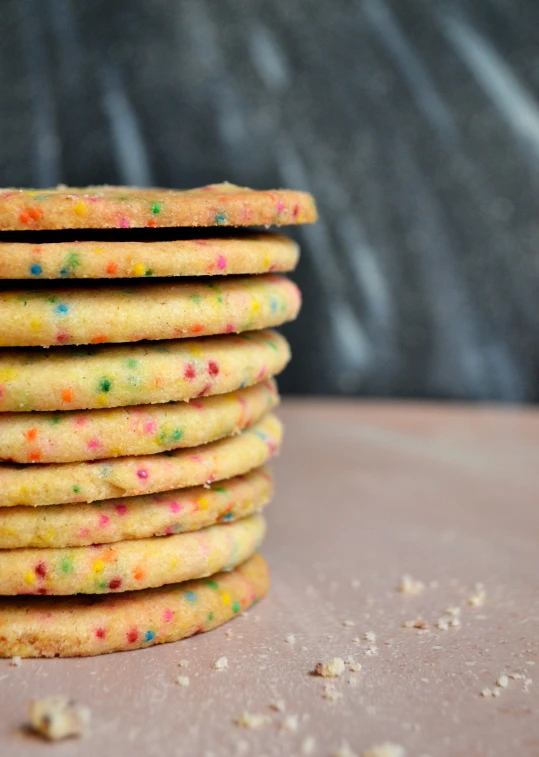 several pieces of sprinkled cookies stacked together