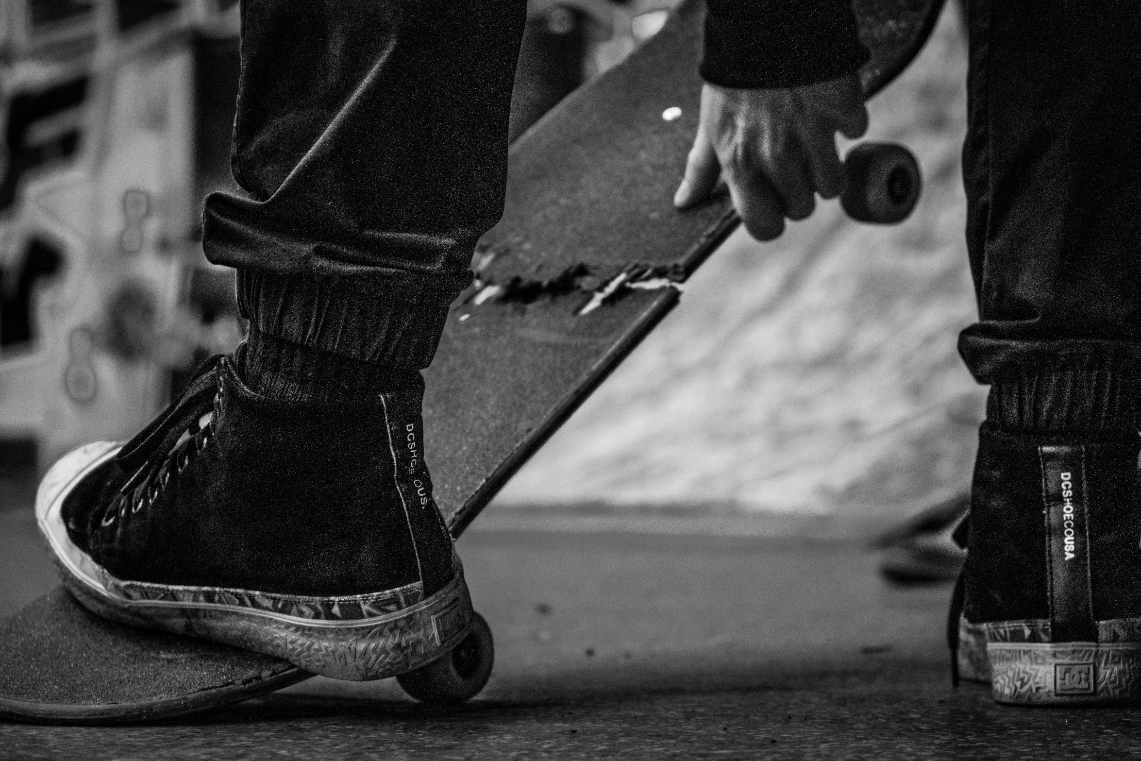 someone is about to take off his skateboard