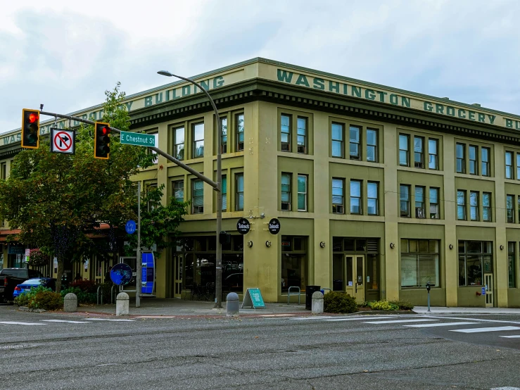 a couple of buildings with green traffic lights on each of them