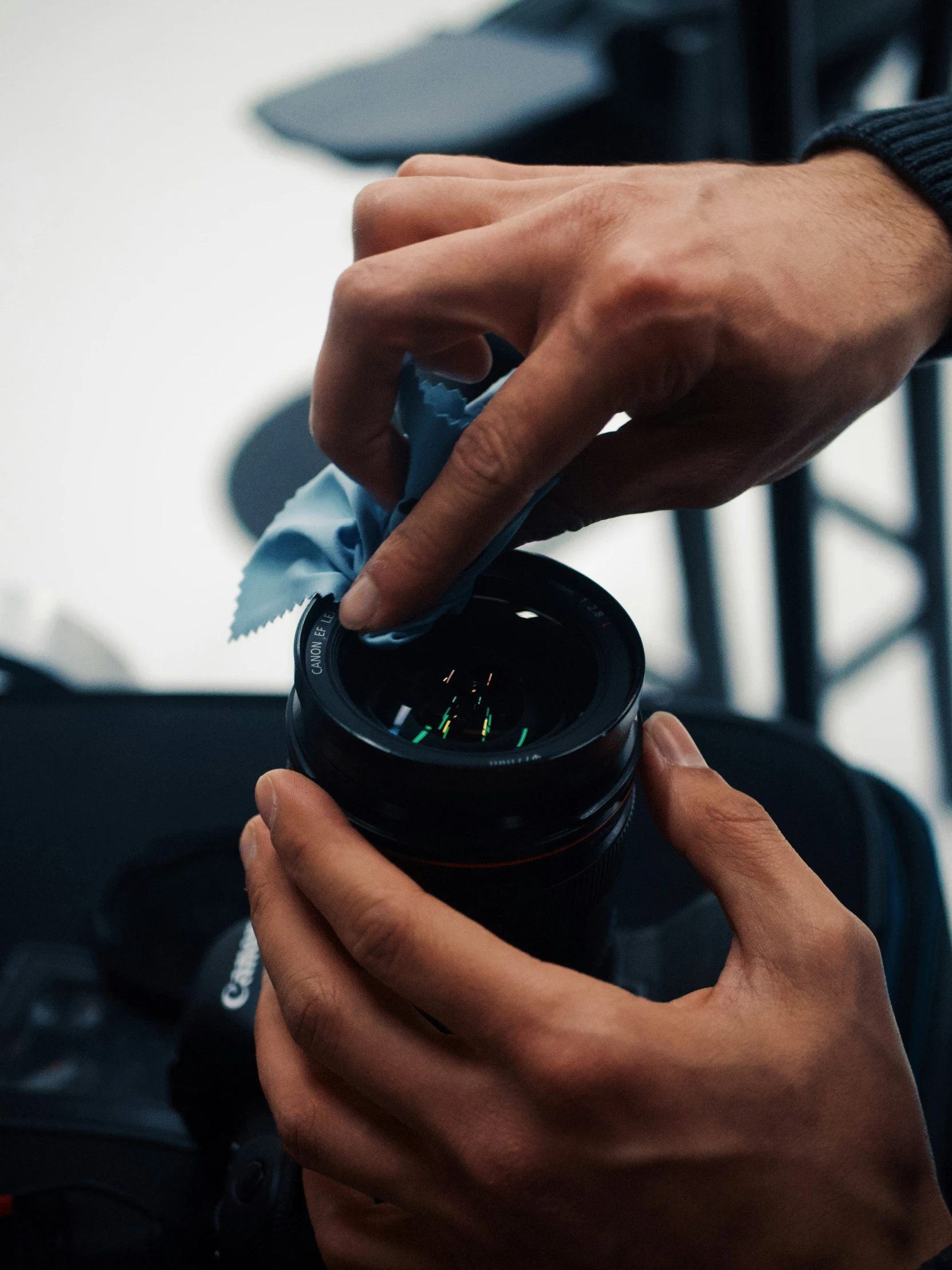 someone placing soing in the plastic jar to use as a container