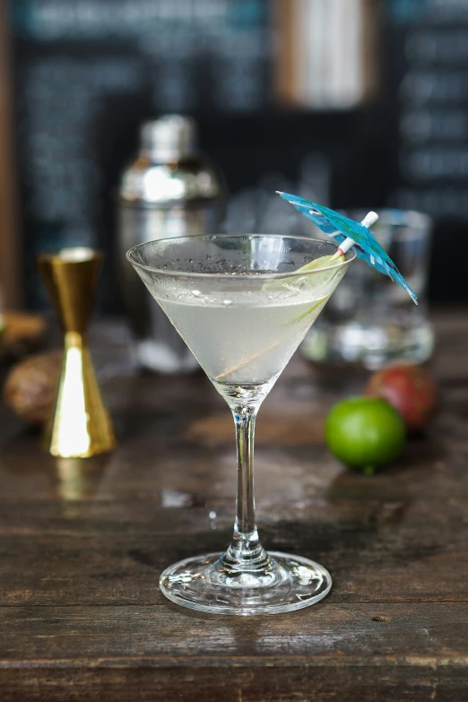 a drink is on a table with an odd shaped bird on it