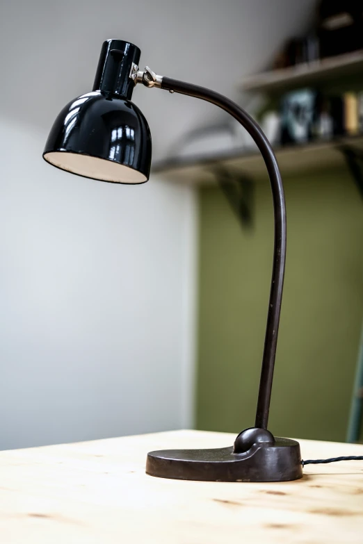 an angled lamp is on a table