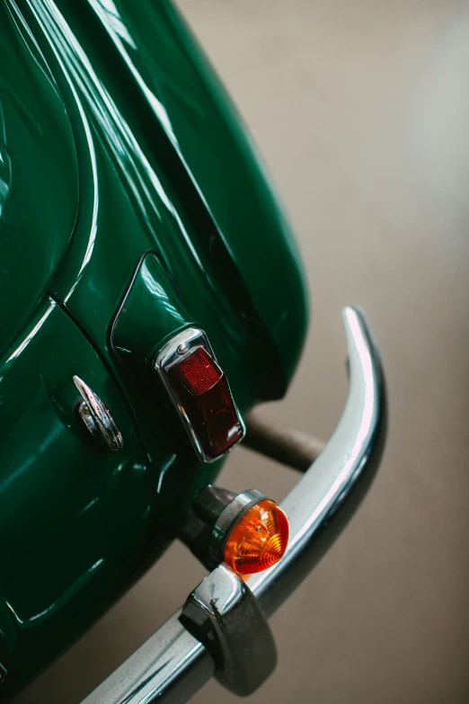 a very unique looking green classic car