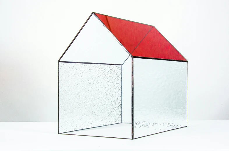 an illustration of a clear square structure with a red roof