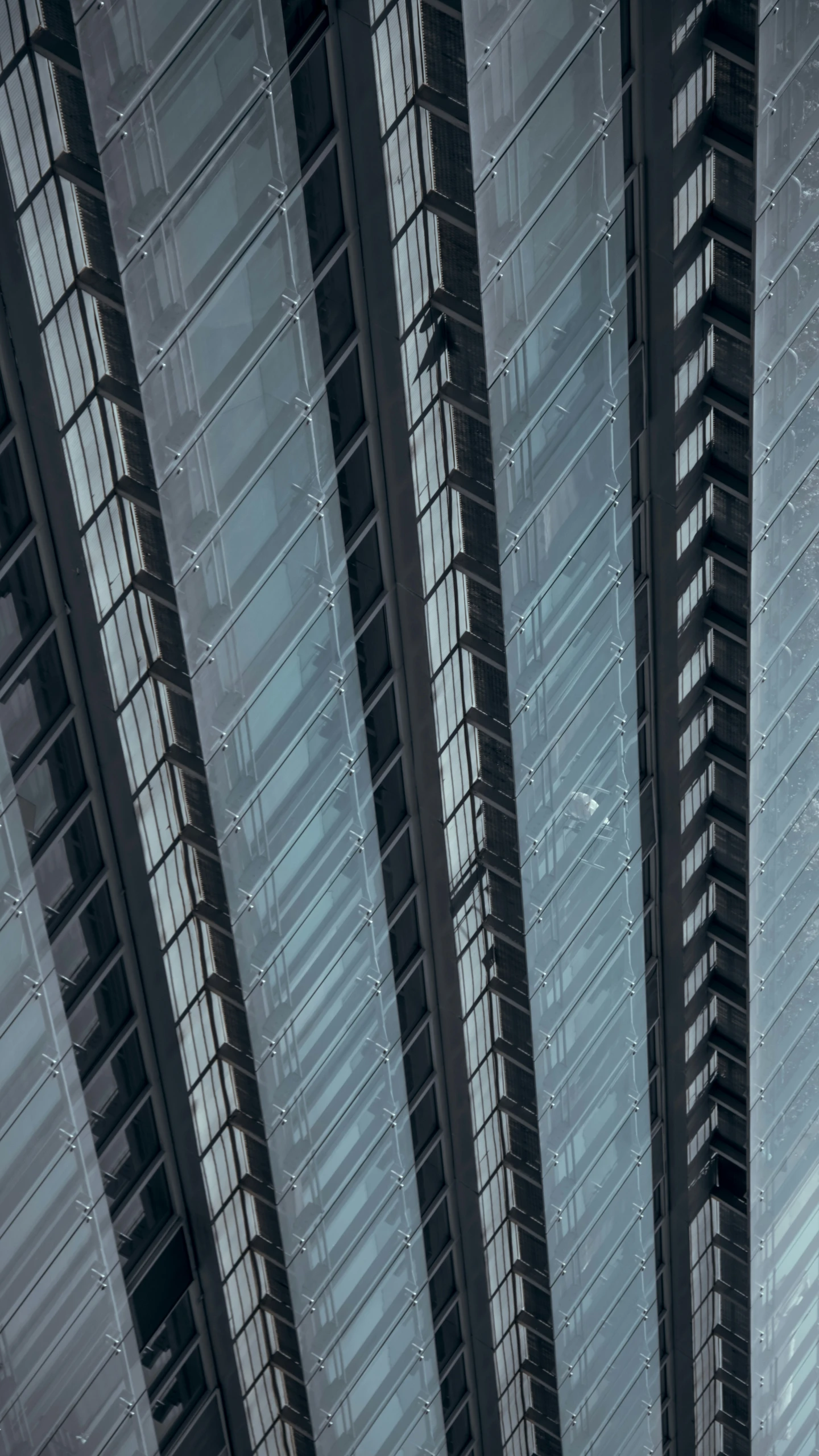 the large airplane is in between two large buildings