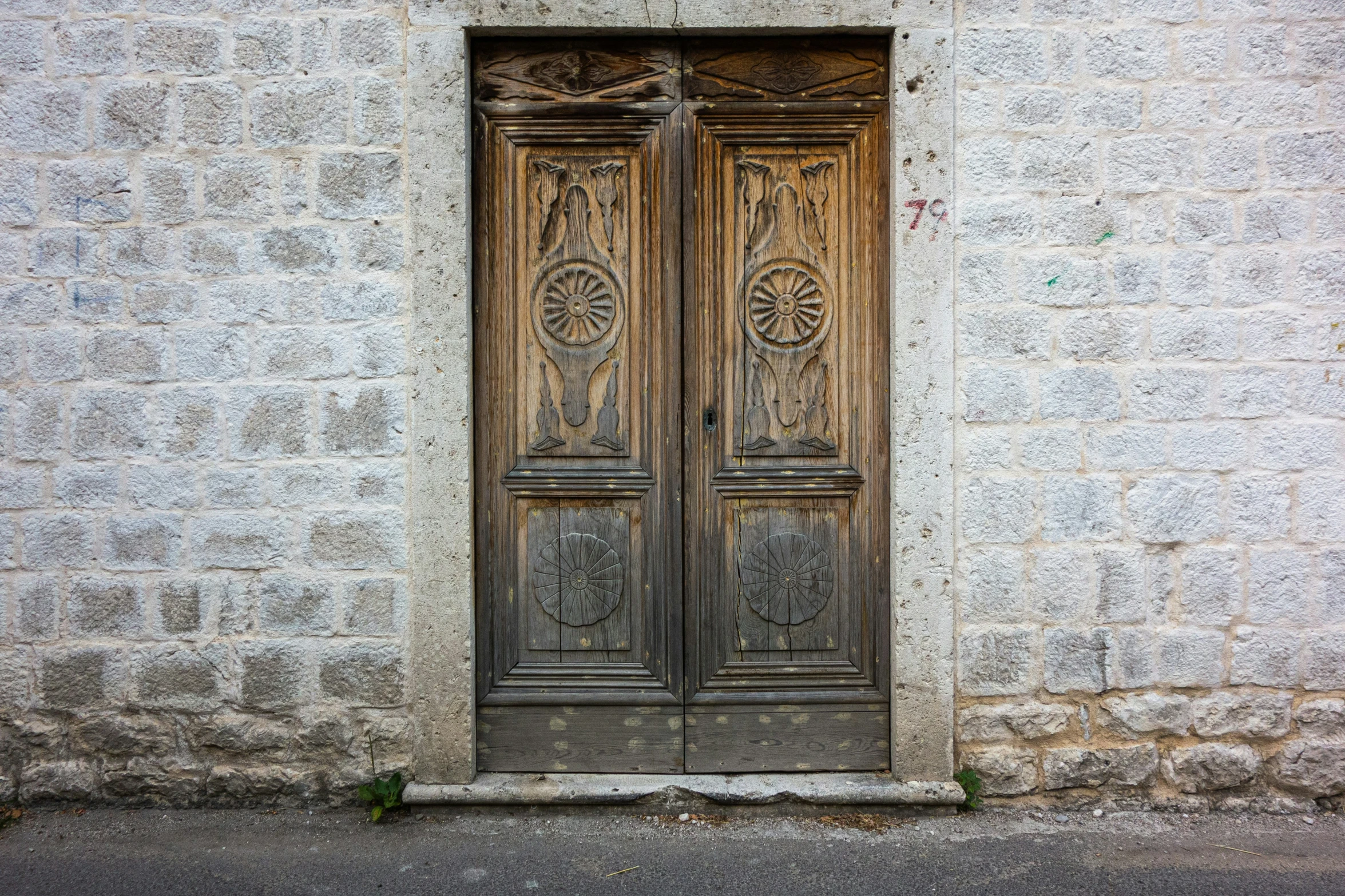 a couple of doors are opened on an old building