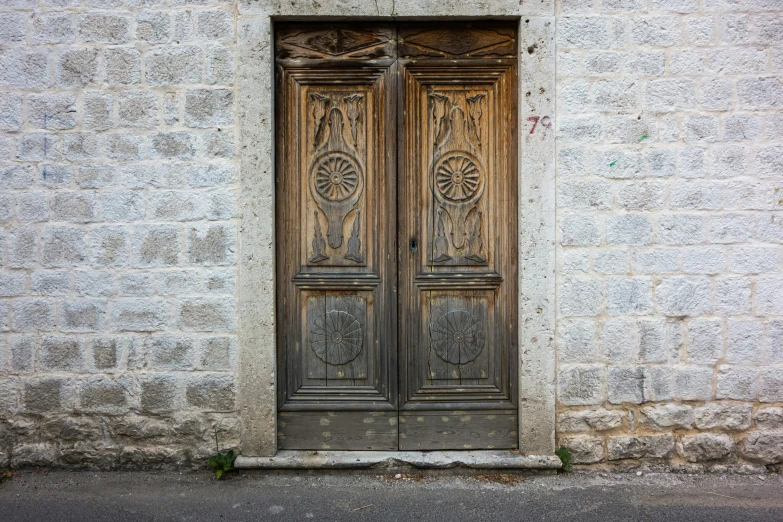 a couple of doors are opened on an old building