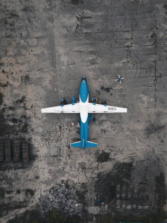 a large airplane flying over a parking lot