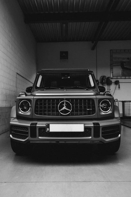 a large car in a room with brick walls