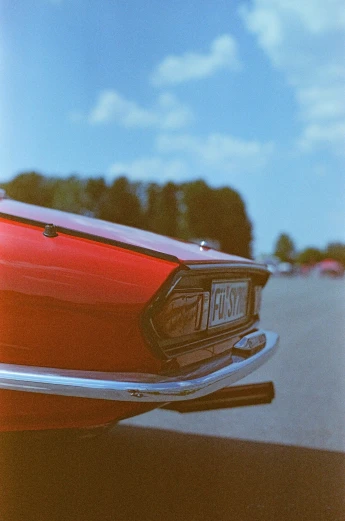 the rear end of an old classic mustang