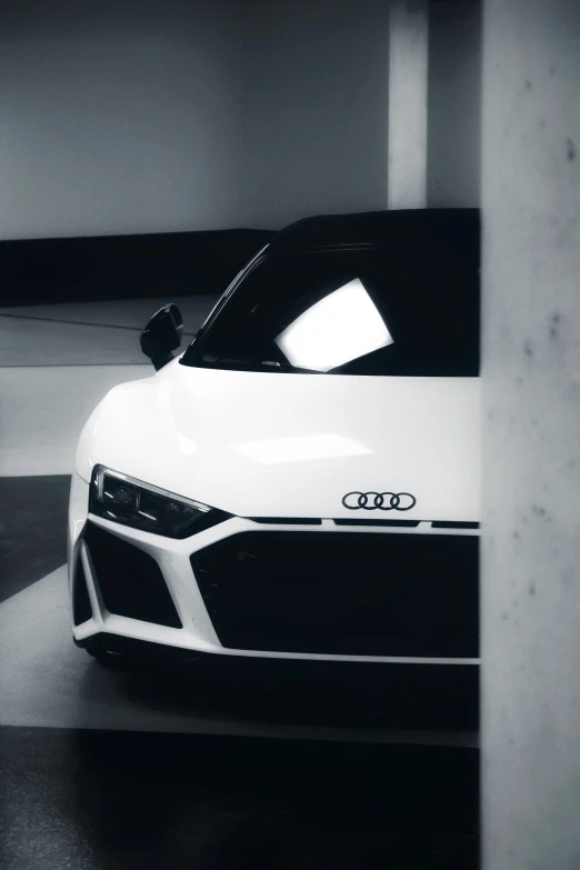 an audi car sits parked in the garage