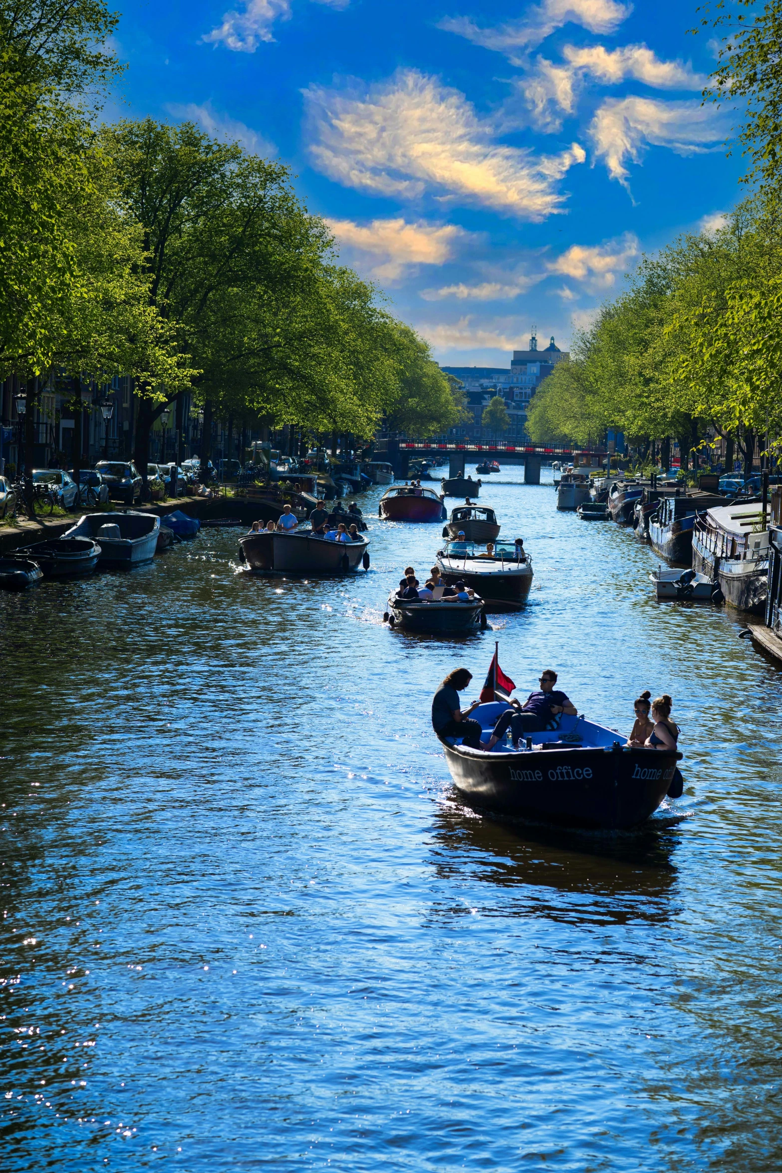 the boats are carrying people in their small boats