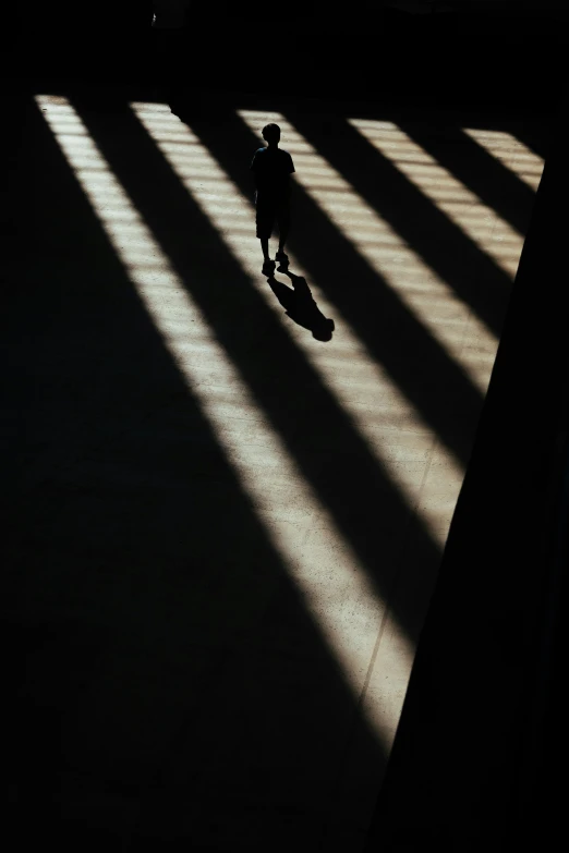 a man riding a skateboard on top of a large floor