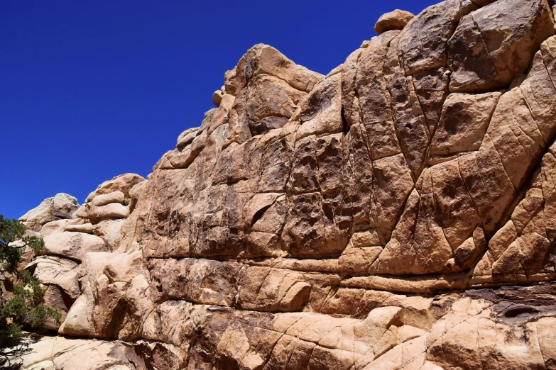 large, rocky rocks on top of each other near the ground