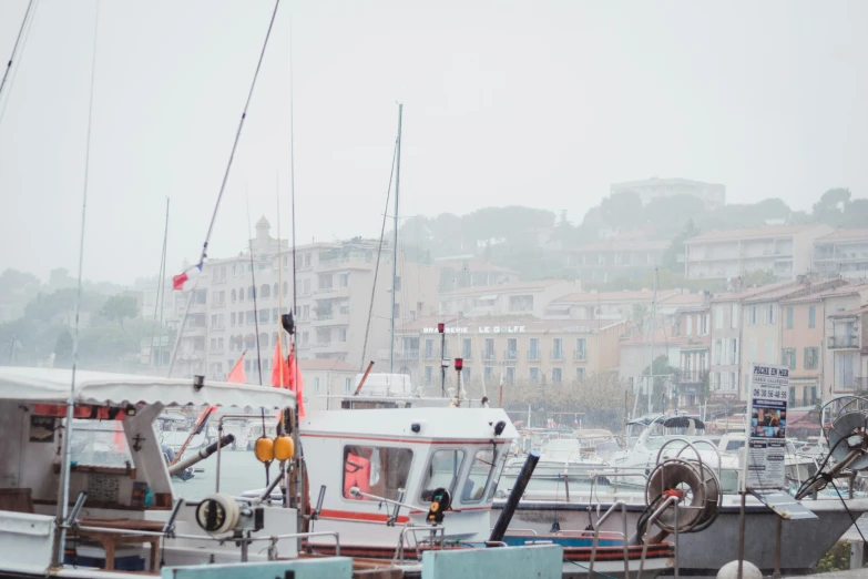 many boats are docked in a large marina