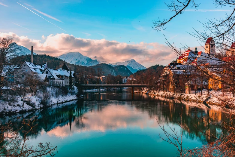 a mountain valley and river surrounded by houses