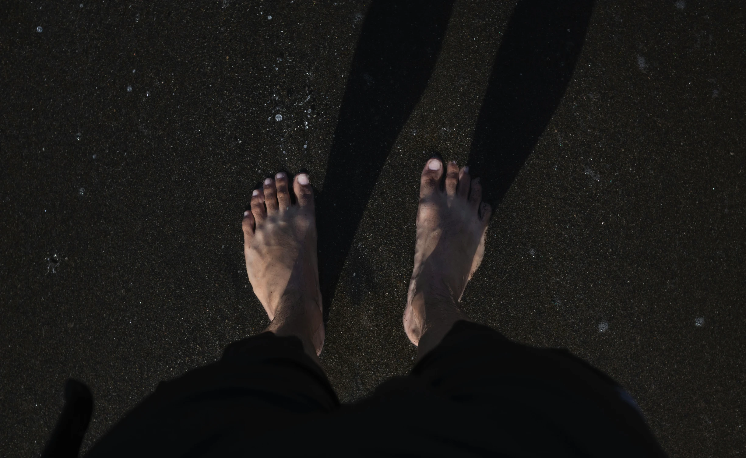 a person with their feet in the dark