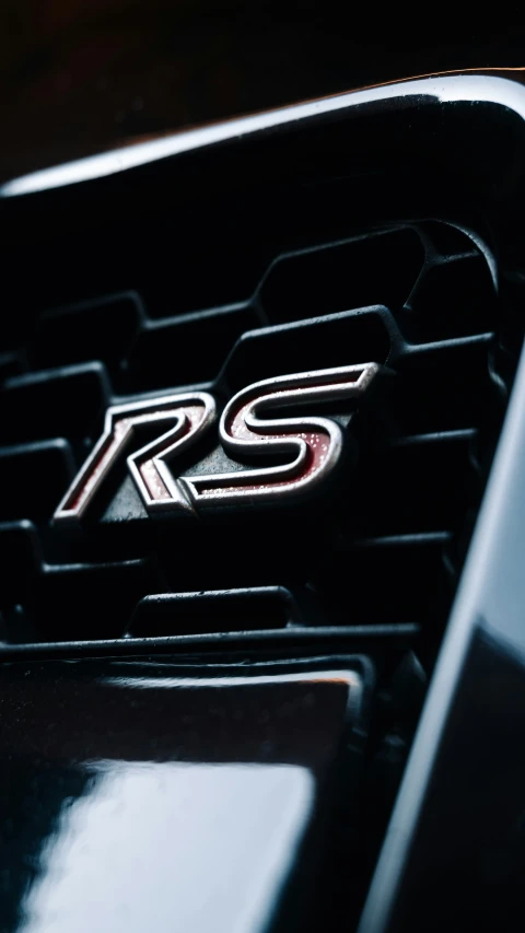 a picture of a badge with the r s emblem