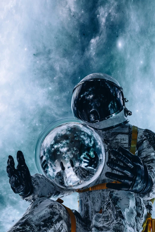 a astronaut sitting in front of his space suits