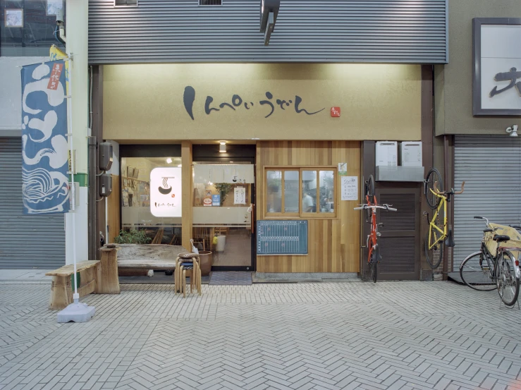 a bicycle is parked outside of an empty shop