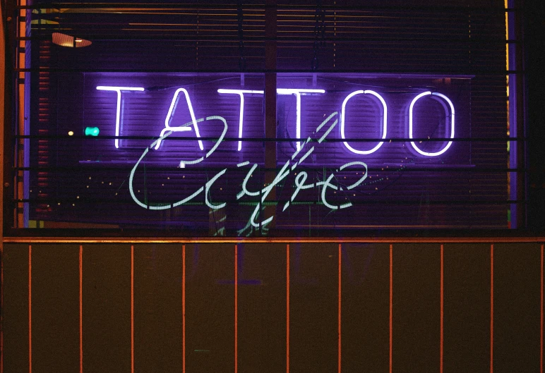 this is an image of a tattoo and cafe sign