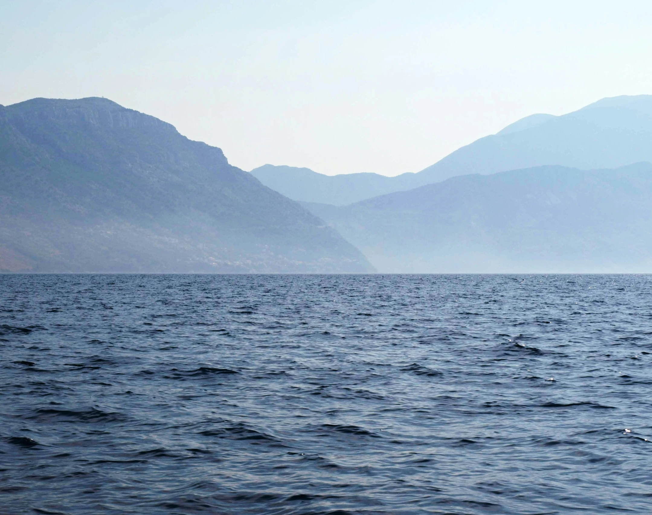 there is a view of mountains and the ocean