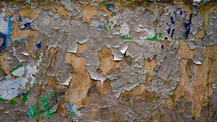 a close up view of paint peeling from a wall