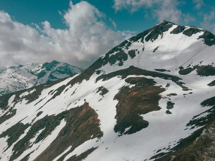 the view down on a snow covered mountain