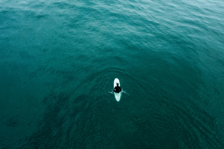 a man is on the water with a boat