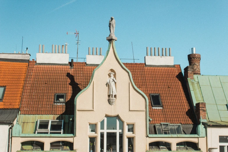 the statue on the roof of a church in europe