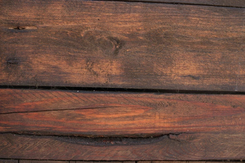 a close up of wood with peeling paint