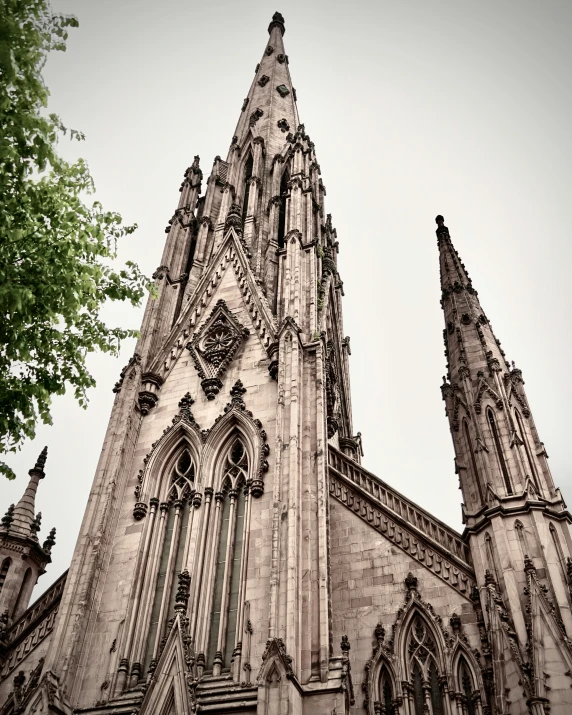 a tall, gothic style church with a very steeple
