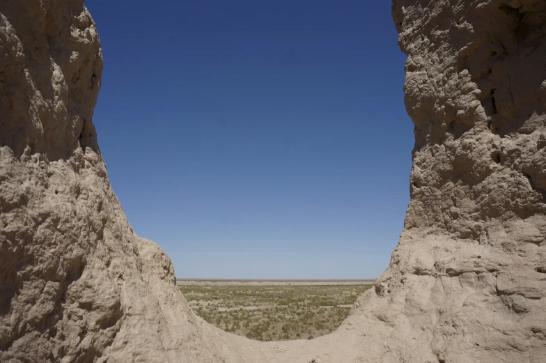 an open desert area with several large rocks