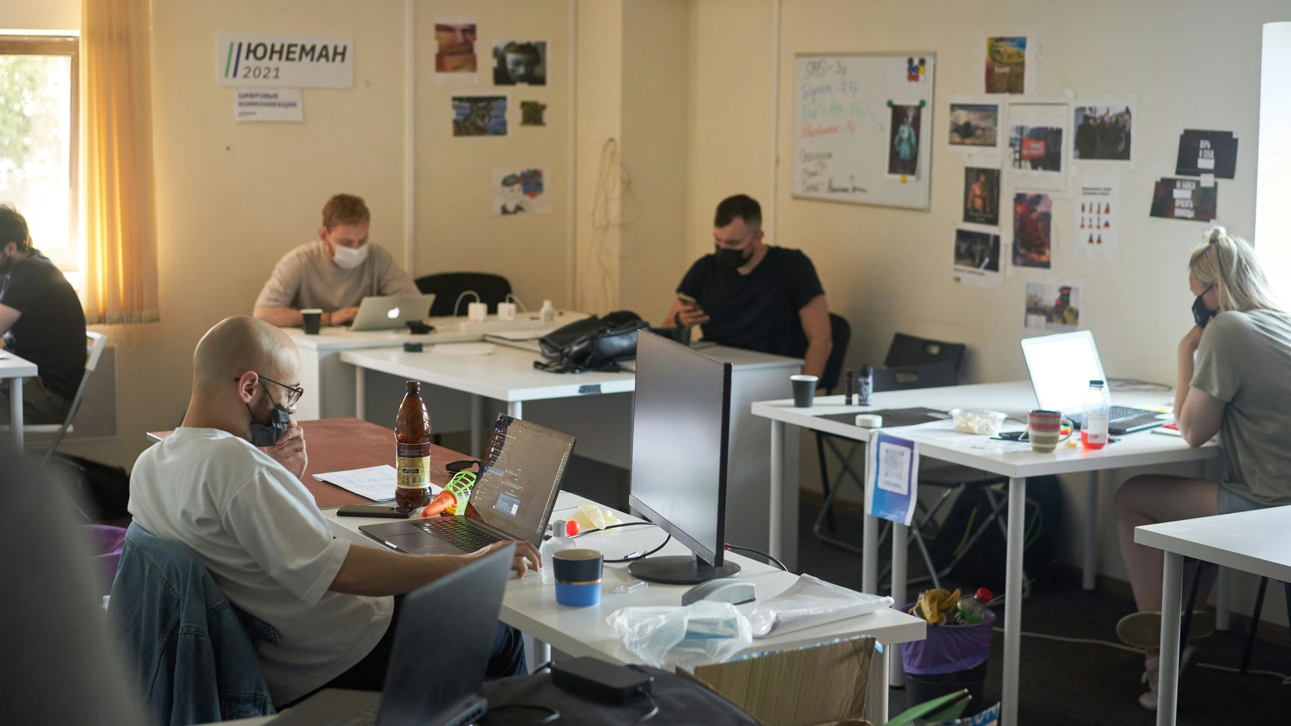 people working on their laptops in an open office