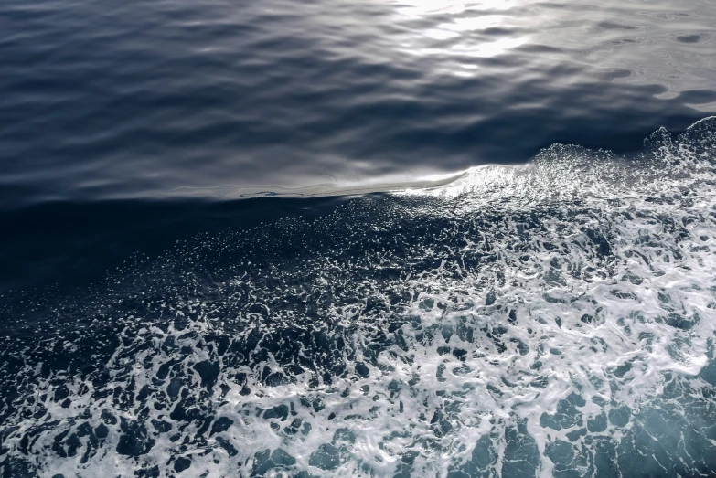 a view of the wake of a boat from above