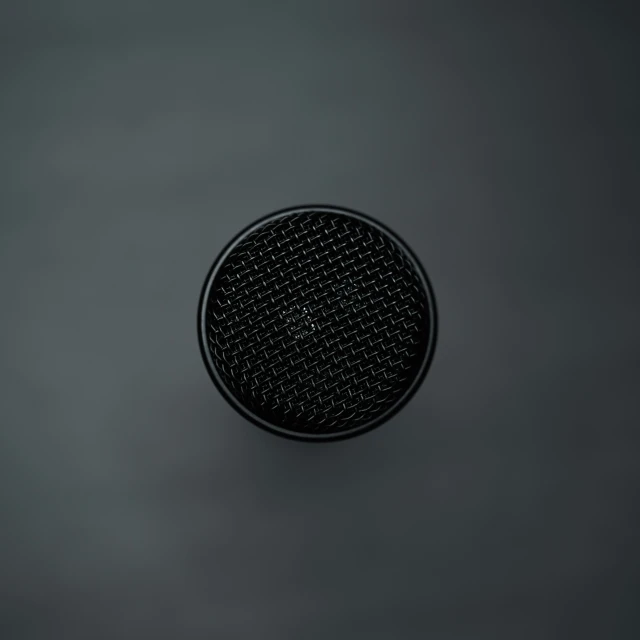 a round black object is positioned on the floor