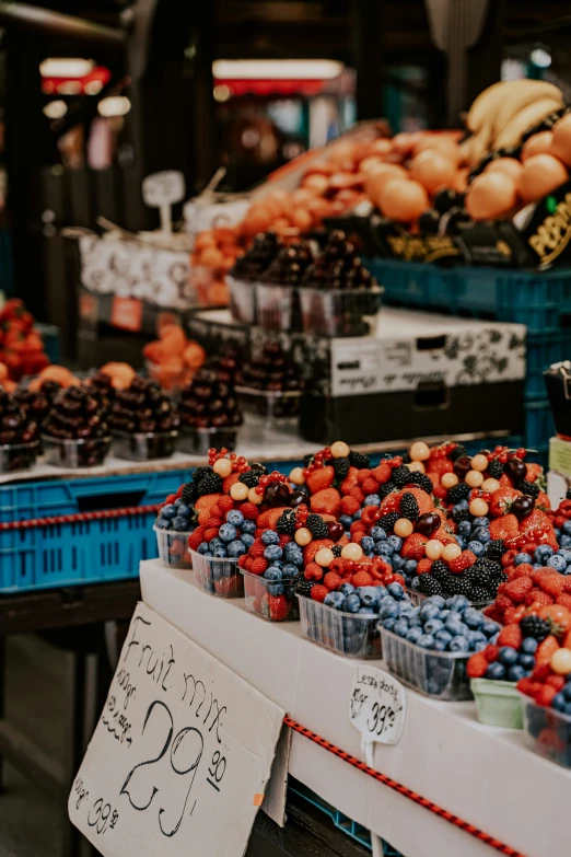 a fruit stand with many fruits in a store