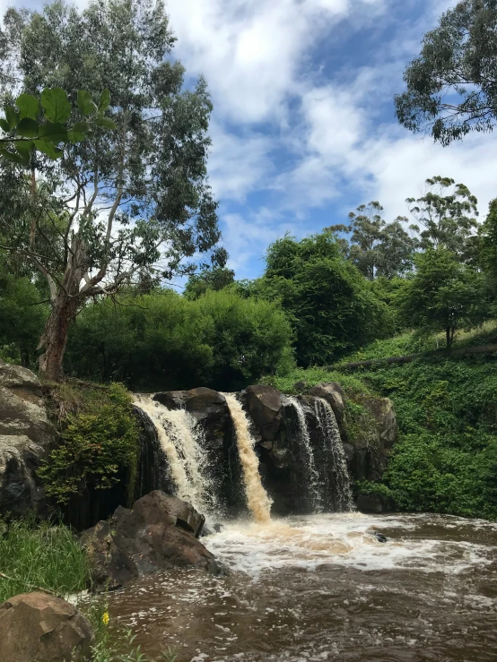 there is a small waterfall that has water casing over it