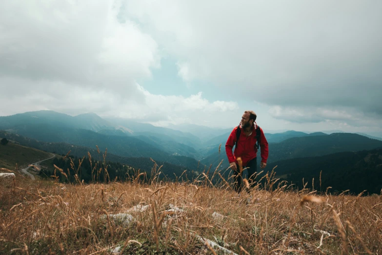 a young man walking up a mountain side