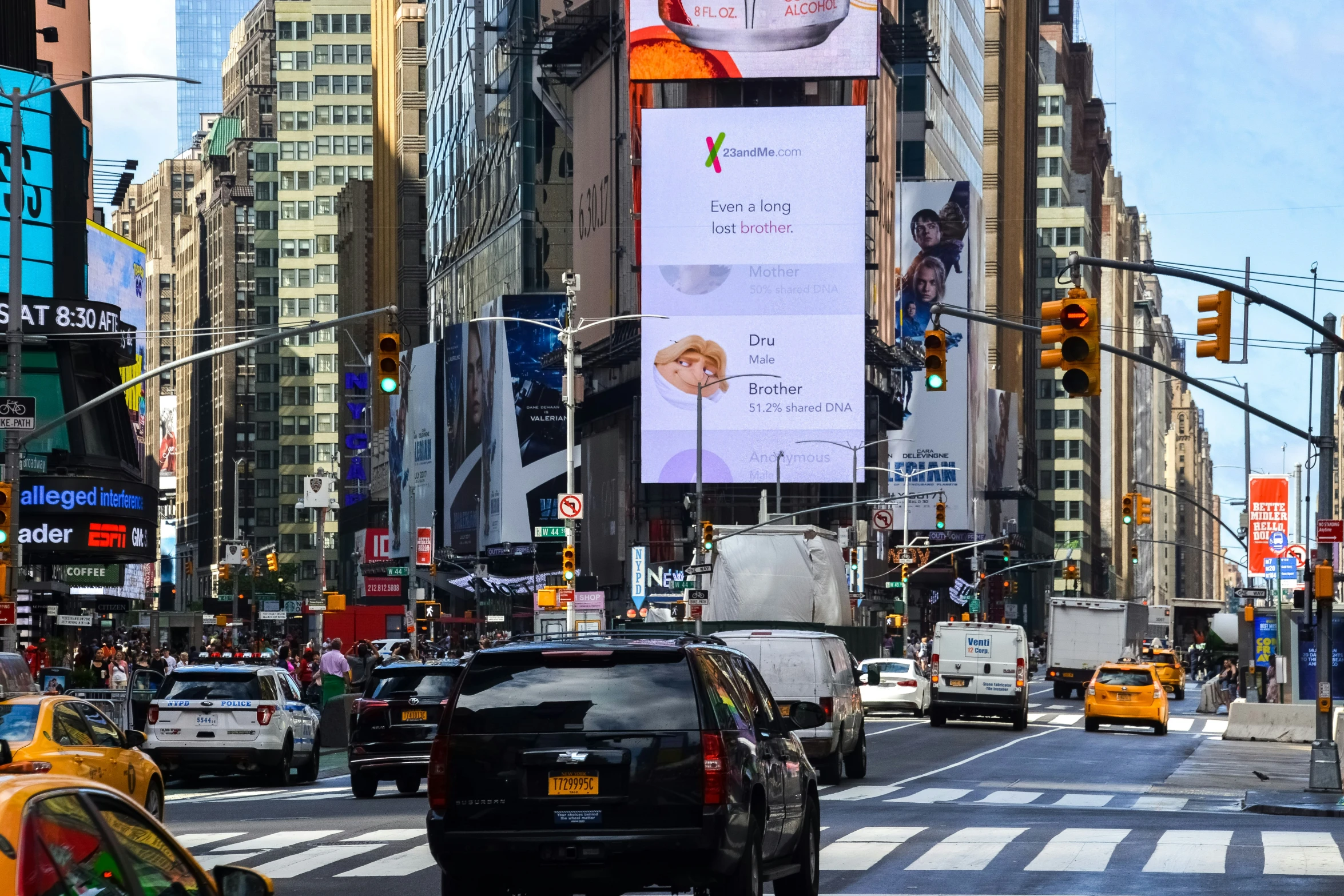 an billboard is in the middle of a busy street