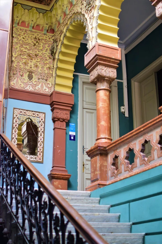 a couple of stairs sitting next to a blue door