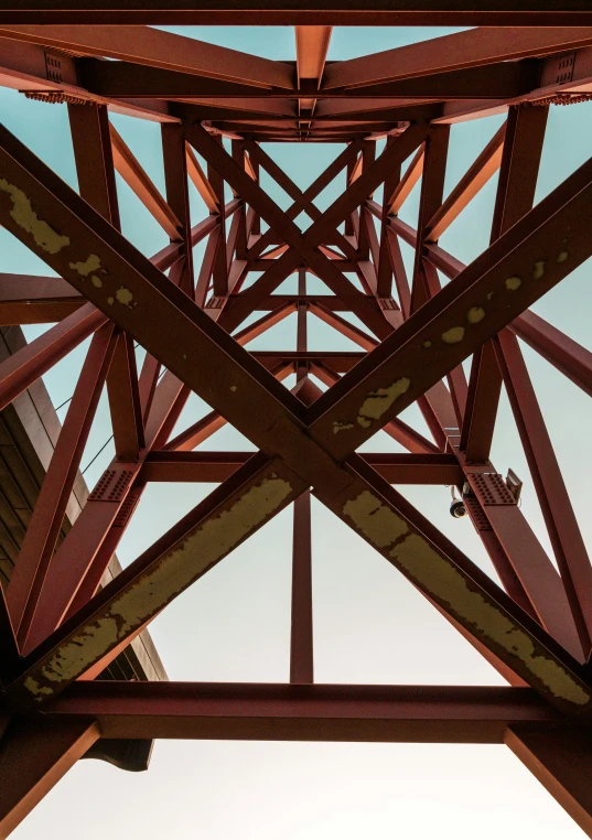 looking up at the underside of an old bridge