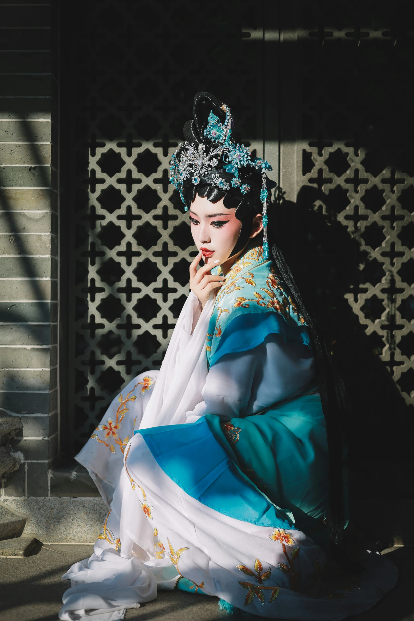 a woman in oriental clothes poses for a picture