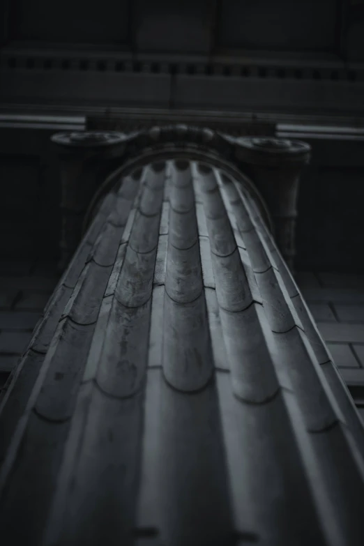 a dark picture of the roof of an old building