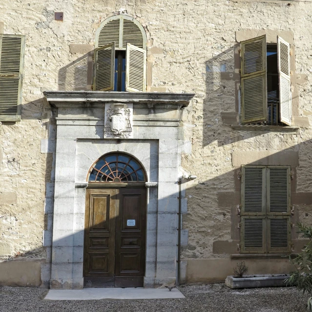 an old building with a clock on the door