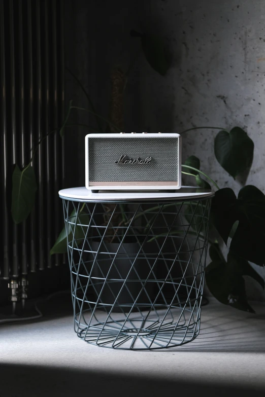 the large white radio is placed on the table